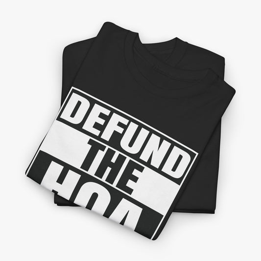 Folded black t-shirt showing the DEFUND THE HOA graphic in white block letters on black and white bars
