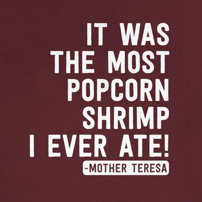 "It Was The Most Popcorn Shrimp I Ever Ate!" - Mother Teresa T-Shirt [Modern Fit] in Maroon - Design Logo Closeup